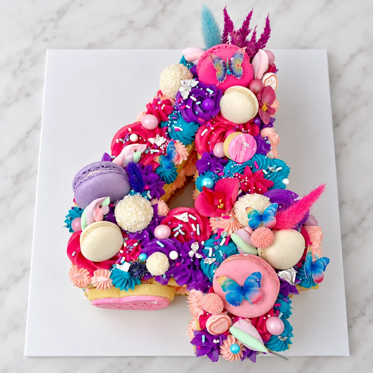 Colourful butterfly number four cake