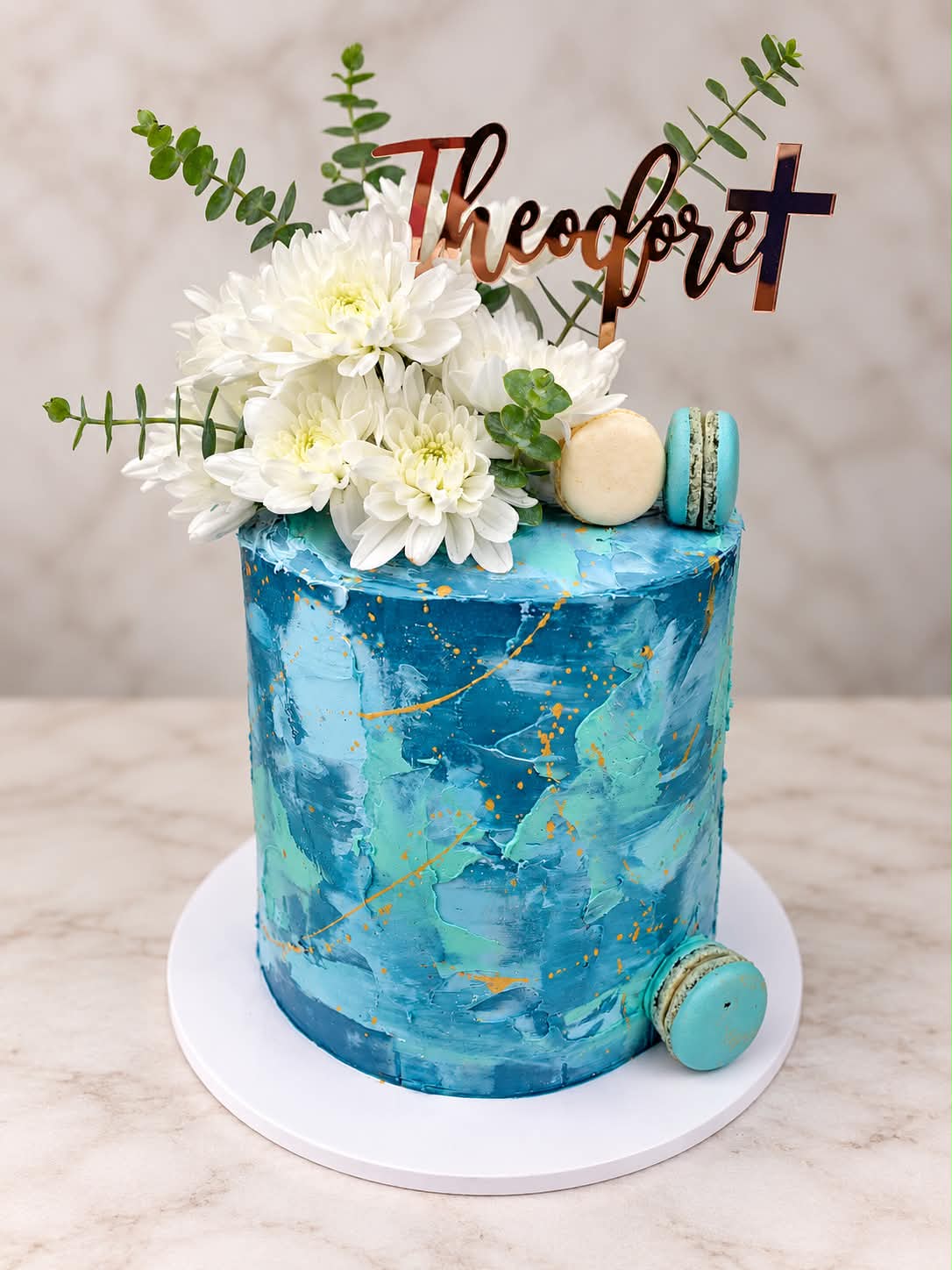 Blue floral christening cake with hand-piped detail